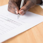 A-picture-of-someone-filling-out-the-application-form-for-an-EU-citizenship-after-seeking-the-help-of-Legaleucounsel.com