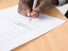 Reasons Why You Should Ask Legal EU Counsel for Immigration Advice A-picture-of-someone-filling-out-the-application-form-for-an-EU-citizenship-after-seeking-the-help-of-Legaleucounsel.com